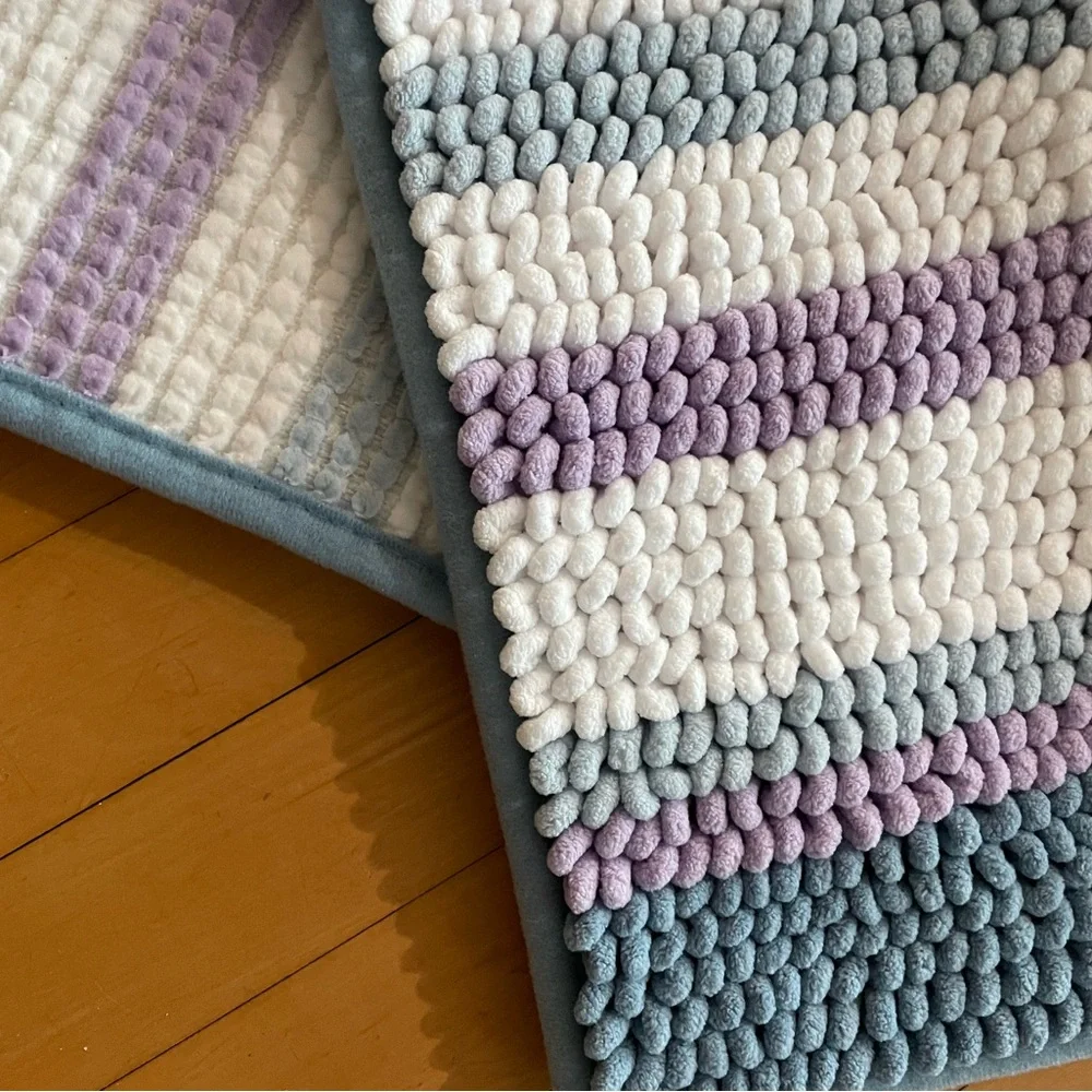 Two - rugs that are purple, white and blue
